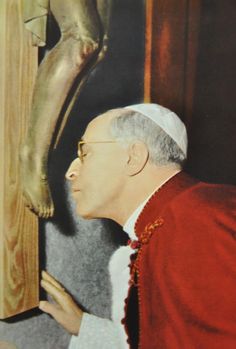 Pope Pius XII venerates the Cross